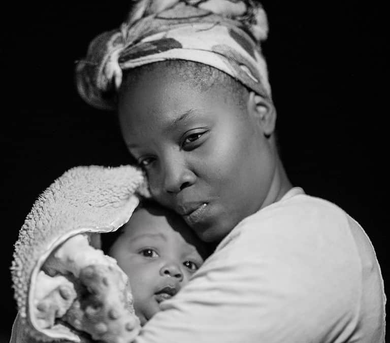 Black mother and child by Andrae Ricketts @Unsplash