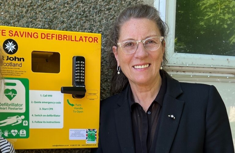Lynn Cleal was awarded OBE for her work as chair of the St John Scotland Public Access Defibrillator Scheme, which was inspired by the Garelochhead and Rosneath Peninsula group.