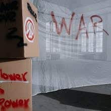 Cardboard boxes with peace and anti-war slogans in a protest setting by cottonbro studio
