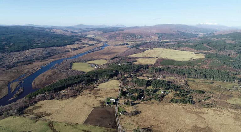 View 745ft (225m) above Achintoul in Altass, with the proposed sites for several wind farm developments, from left to right: Inveroykel, Strathoykel, Collie Beith, Allt an Tuir and Invercassley. Of the 88 turbines projected in these sites, some have a height of about 225m. By Gregor Laing