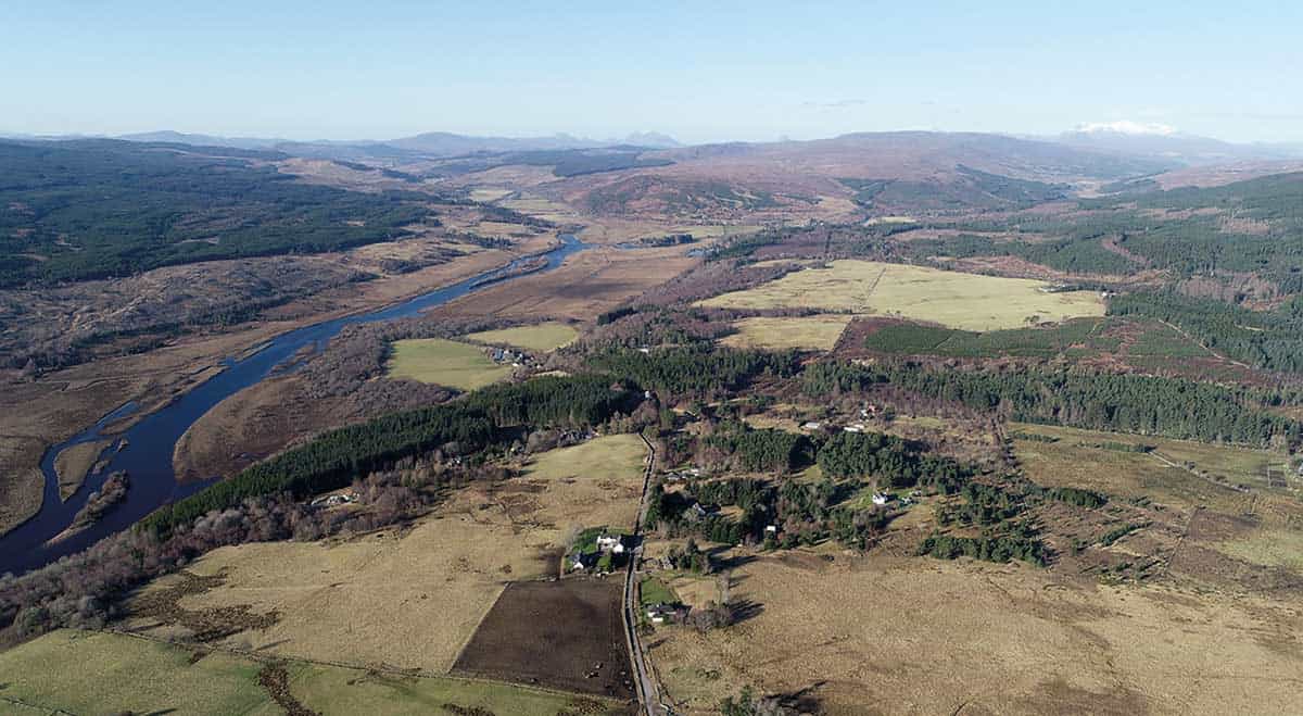 View 745ft (225m) above Achintoul in Altass, with the proposed sites for several wind farm developments, from left to right: Inveroykel, Strathoykel, Collie Beith, Allt an Tuir and Invercassley. Of the 88 turbines projected in these sites, some have a height of about 225m. By Gregor Laing